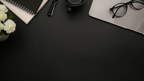 Modern black office desk workspace background with office accessories and copy space for product or text display. top view, flat lay - Foto, imagen