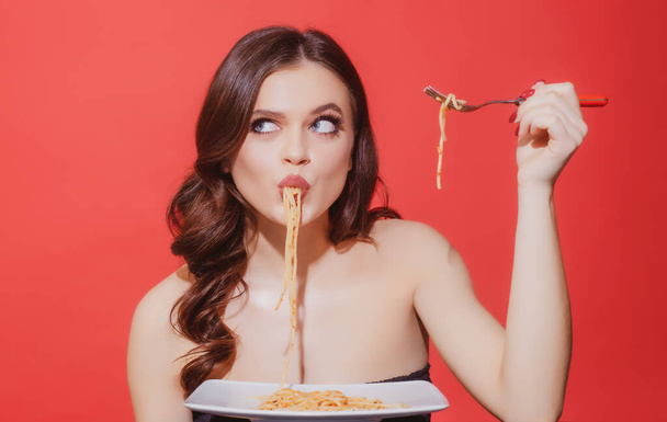 Italian cuisine healthy menu. Sexy woman eat tasty pasta. Food from Italia. Spaghetti Bolognese. - Фото, зображення