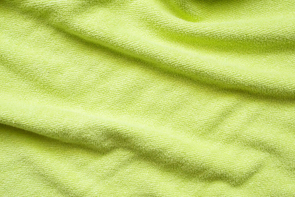 Groene handdoek weefsel textuur oppervlak close-up achtergrond - Foto, afbeelding