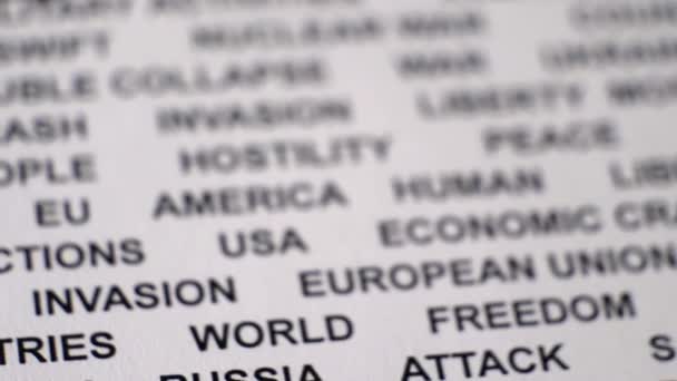 Closeup shot of UKRAINE PUTIN written on white paper with circles around them. - Footage, Video