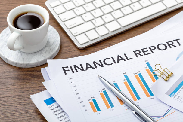 Financial report and accounting data documents with computer on office desk, financial statement review - Foto, Imagem