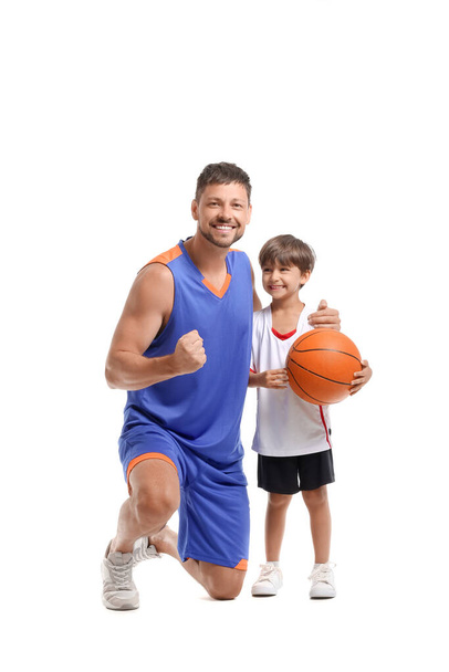 Little boy with ball and his trainer on white background - Photo, Image