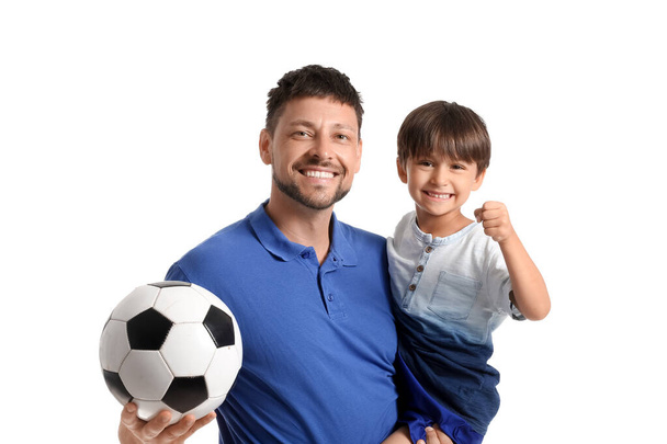 Male trainer with soccer ball and little boy on white background - Фото, зображення