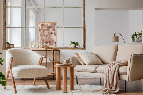 Stylish compositon of neutral living room interior with frotte armchair, sofa, creative painting, wooden commode, side table and elegant home accessories. Template. Copy space. - Foto, Imagen