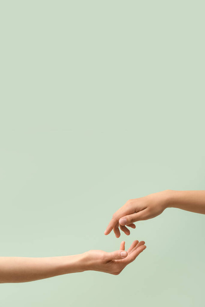 Hands of women on color background - Foto, imagen
