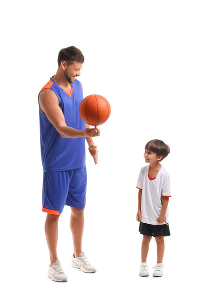Little boy and his trainer with ball on white background - Φωτογραφία, εικόνα