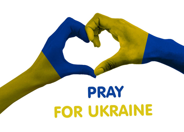 Módl się za Ukrainę. Ręka w kształcie serca. Koncepcja solidarności z Ukrainą w wojnie z Rosją - Zdjęcie, obraz