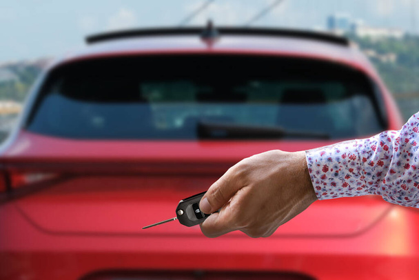 hand holding car key, selective focus - Photo, Image