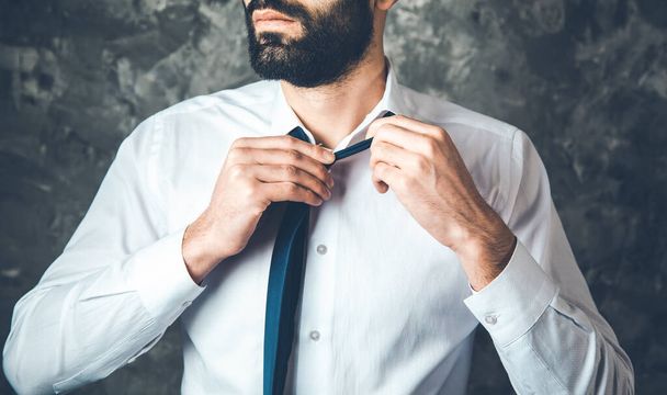 man hand in tie on abstract background - Φωτογραφία, εικόνα