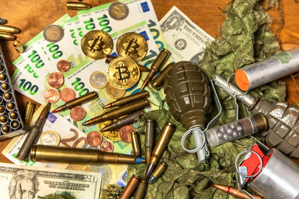 Support for Ukraine. War in Ukraine. Euro coins and banknotes and cartridges of different caliber. Sale of weapons. Ammunition for war - Zdjęcie, obraz