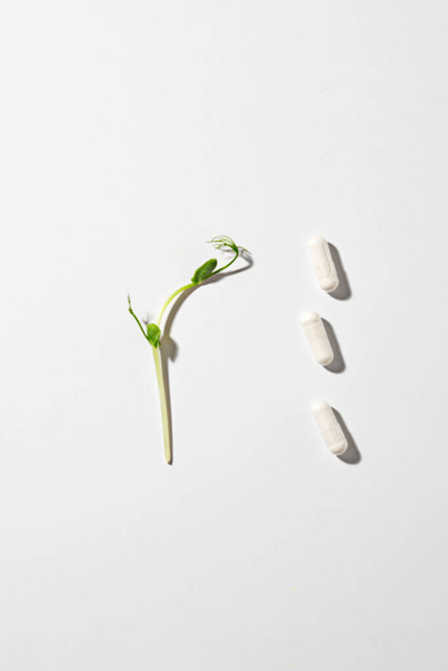 Multivitamins arranged on a bright white background. Vertical view. - Photo, Image