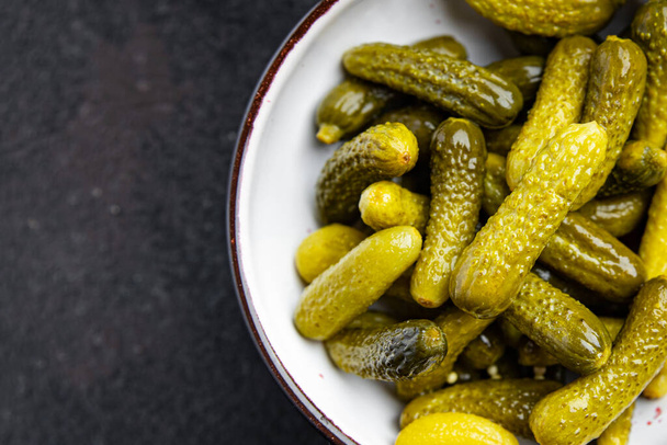 gherkins salted cucumbers pickled vegetable fresh portion healthy meal food diet snack on the table copy space food background  - Photo, Image