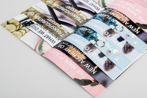 top view of several beauty magazines on grey background - Photo, Image