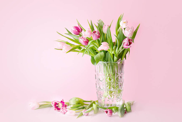 spring tulips on pink background. Greeting card for mothers day. - Фото, зображення