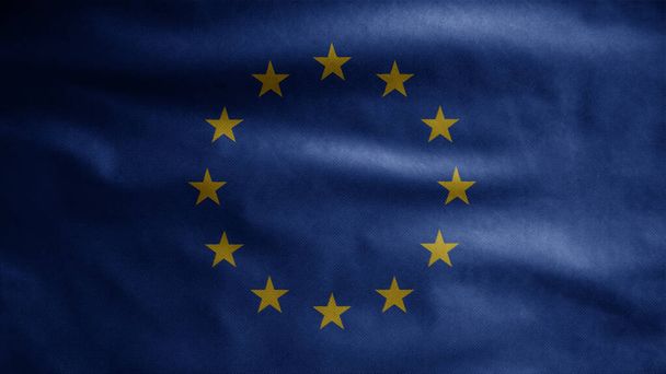 欧州連合の旗が風になびく。柔らかいシルクを吹いてヨーロッパのバナーを閉じます。布生地の質感が背景を刻印。ナショナルデーや国の機会の概念のためにそれを使用する. - 写真・画像
