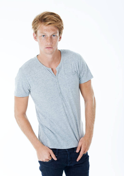 Feeling confident and looking casual. Studio portrait of a handsome young man with ginger hair. - Photo, image