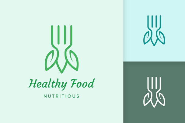 healthy food logo with fork and leaf shape - Vector, imagen