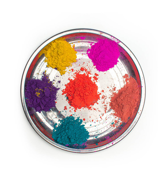 Багатобарвна сталева ложка з різними кольорами для святкування Холі
 - Фото, зображення