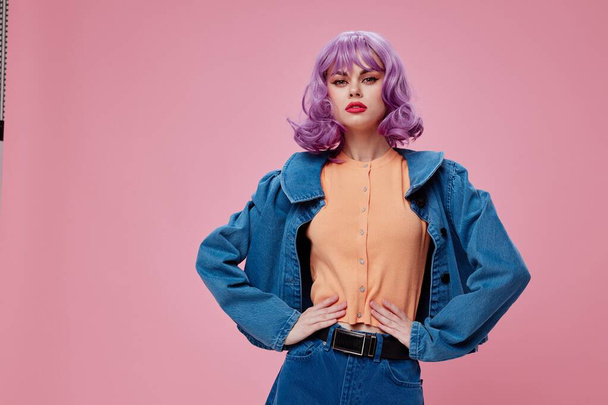 Beautiful fashionable girl purple hairstyle red lips denim jacket fun color background unaltered - Photo, Image