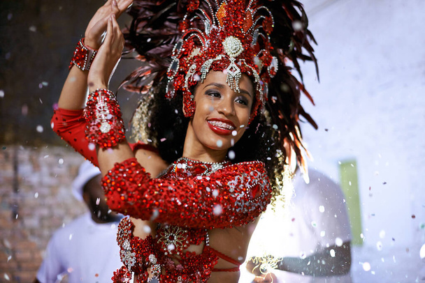 Celebrating in style. Cropped shot of an attractive ethnic female wearing traditional Mardi Gras wear. - 写真・画像