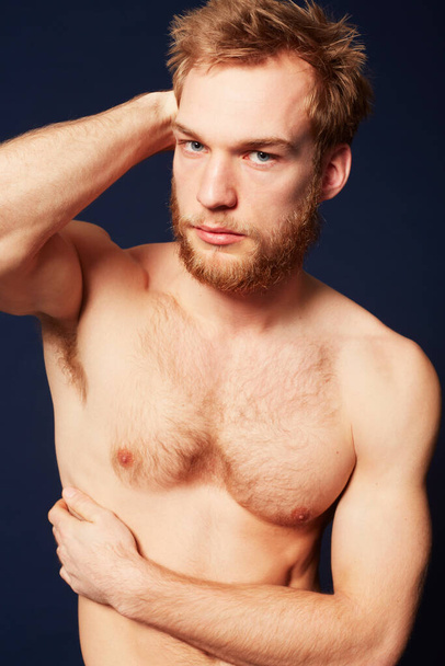 Hes a model thinker. Cropped view of a muscular man looking at the camera. - Foto, Bild
