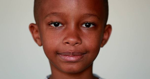 Serious African little boy portrait looking at camera - Φωτογραφία, εικόνα