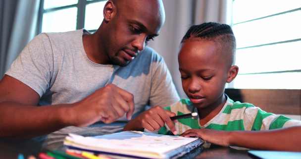 Little boy studying at home doing homework with father help - Foto, Imagem