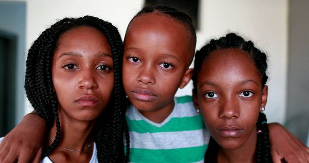 African American kids looking at camera. Little boy and teen girls. Mixed race black ethnicity children - Photo, image