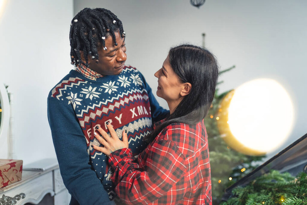 African-American Man Hugging His European Wife. Holidays in interracial relationship. - Valokuva, kuva