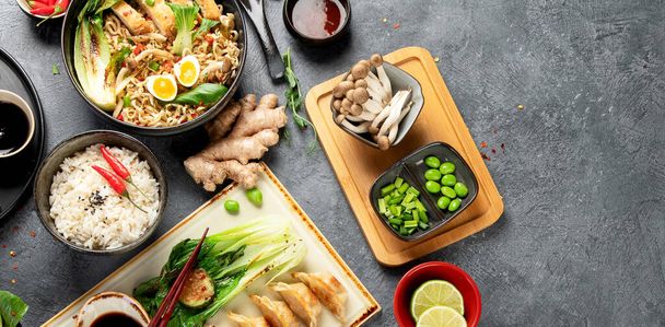 Asian food on dark background, panorama with copy space. - Foto, imagen