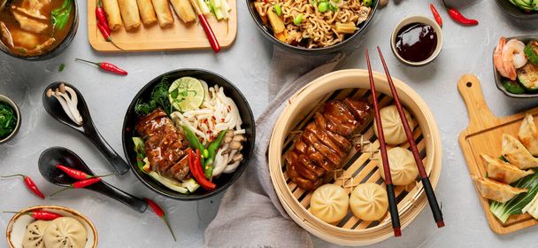 Assorted Chinese food set on light background. Traditional food concept. Asian style banquet. Top view, flat lay, copy space - Zdjęcie, obraz
