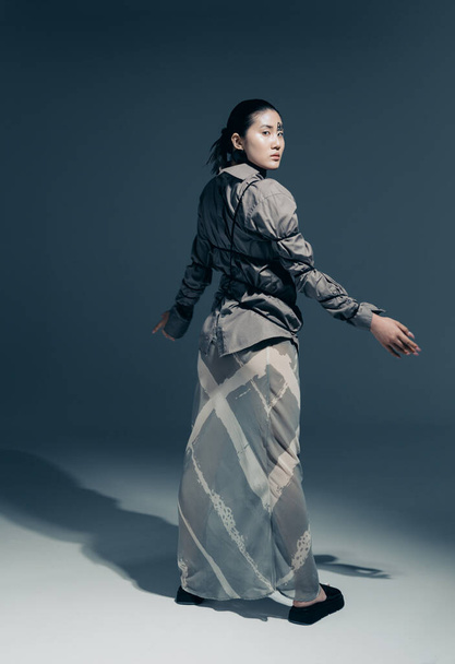 Art fashion portrait of a girl with Asian appearance in the studio  - Фото, зображення