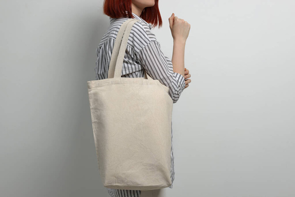 Woman with eco bag on white background, closeup - Fotó, kép