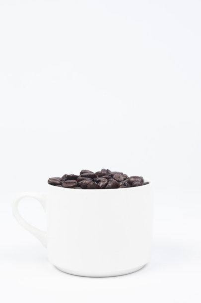Coffee cup with coffee beans - Фото, зображення