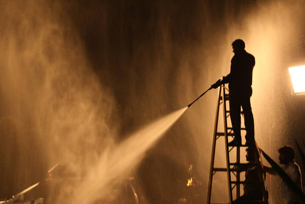 Silhouette Of Firefighter with Fire Hose Nozzle - Photo, Image