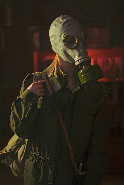 military girl in a gas mask against radiation - Photo, Image