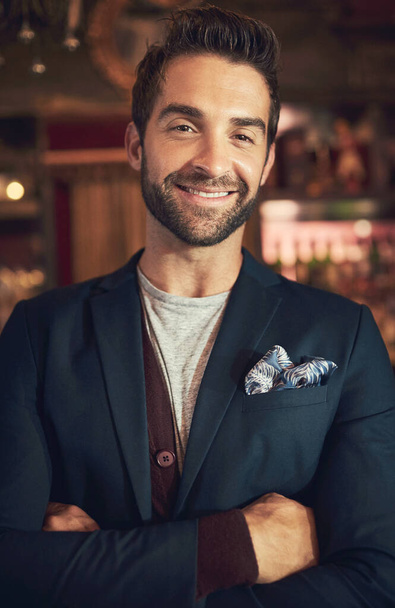 The life of a bachelor. Cropped portrait of a young man standing in a bar. - Foto, Imagen