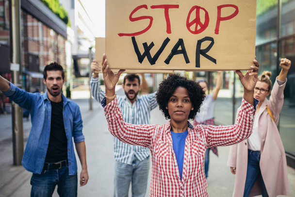 Anti-war protest. Demonstrators call for peace. Protest manifestation against attack or war. - Photo, Image