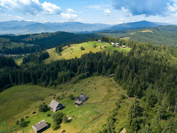 Green mountains of Ukrainian Carpathians in summer. Sunny day. Aerial drone view. - Photo, Image