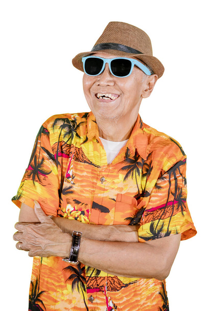 Close up of senior man folded hands while wearing summer clothes and standing in the studio. Isolated on white background - Photo, Image