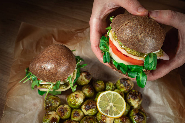 Healthy Vegan Burger. Hamburgers on a wooden table. - Photo, Image