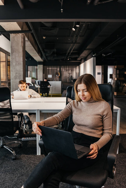 23.11.2018 Kyiv, Ukraine: photo of young people working at a computer in a modern coworking office - 写真・画像