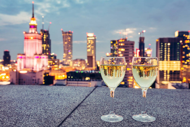 Wine with view on Warsaw, Poland at night. Luxury travel - Photo, Image