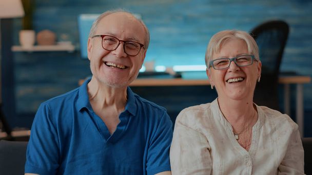 Portrait of cheerful grandparents laughing in front of camera - Photo, Image