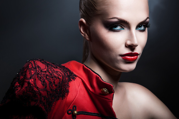 Woman in red jacket with red lips - Photo, image