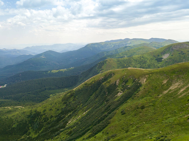 High mountains of the Ukrainian Carpathians in cloudy weather. Aerial drone view. - Photo, Image