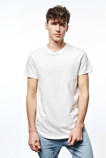 Portrait of handsome man in white t-shirt isolated on white background   - Fotó, kép
