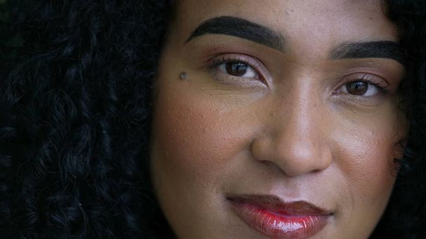 Portrait of a black woman smiling at camera face close-up of a latina Brazilian person - Fotografie, Obrázek