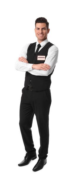 Full length portrait of happy receptionist in uniform on white background - Foto, imagen