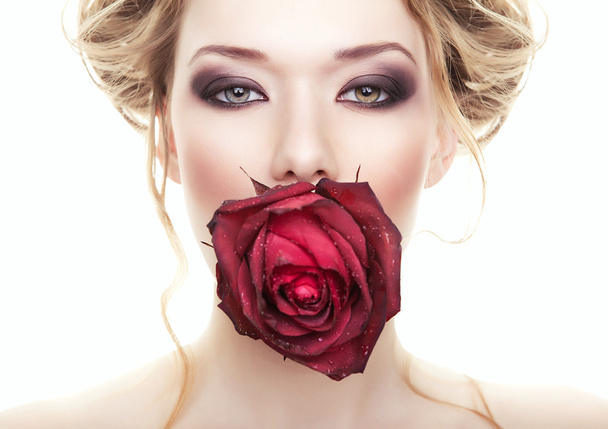 woman with rose in mouth - Fotoğraf, Görsel